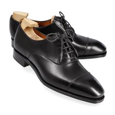 WOMEN'S OXFORDS IN BLACK VITELLO Classic Cap Toe Oxfords For Galas, Classic Oxfords With Rubber Sole For Galas, Classic Black Cap Toe Lace-up Shoes, Timeless Black Oxfords With Round Toe, Classic Cap Toe Lace-up Shoes For Galas, Timeless Black Almond Toe Oxfords, Classic Black Oxfords With Almond Toe, Classic Black Oxfords, Cap Toe Oxfords With Rubber Heel Cap For Galas