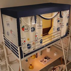 a bunk bed with blue and white curtains on it