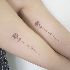 two tattoos on both legs with roses and the word love written in cursive writing