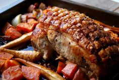 meat and vegetables are in a pan on the table