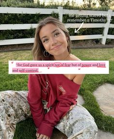 a woman sitting on the ground with a sign in front of her that says, for god gave us a spirit of fear but of power and love and control