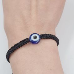 Throughout the whole human history, in every culture and religion, the eye figure has been considered as a powerful talisman to defy evil forces. One of the most popular amulets is the blue glass eye charm. The evil eye is a curse or legend believed to be cast by a malevolent glare usually catching a person unaware. You can wear an evil eye bracelet or lucky eye necklace to save yourself from negative energies, such as anger, hatred, fear, jealousy and other such evil energies that can affect yo Blue Evil Eye Bracelets, Blue Evil Eye Bracelet Gift, Spiritual Round Evil Eye Bracelet, Blue Spiritual Bracelet For Good Luck, Adjustable Spiritual Evil Eye Bracelet, Black Beaded Bracelet With Evil Eye, Adjustable Spiritual Evil Eye Jewelry, Spiritual Evil Eye Bracelet For Good Luck, Spiritual Black Evil Eye Bracelet As Gift