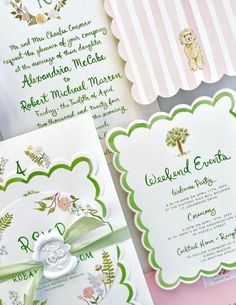 the wedding stationery is laid out on top of each other