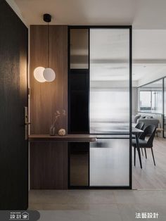 an open living room and dining area with sliding glass doors