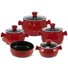 red pots and pans with black lids are shown in this image on a white background