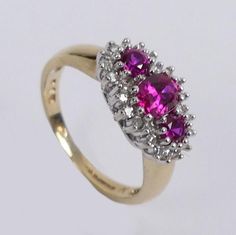 Item Description:- A fine 9 carat gold Faux Ruby and Diamond Dress Ring.  It comes in the Plush lined presentation box shown.      Size:-  UK size K - band 2 mm wide, face 8.7 mm wide. US size 5 1/8. 2.9 grams.     Condition:- In good condition.       Item Number:-  6900 - 022/1538 Cromwells  Antique Centre is open from 10am - 5pm 7 days a week! For any questions or queries please telephone or email us -  Tracy Large Cromwells Antique Centre The Maltings, Station road Sawbridgeworth Hertfordshir Classic Pink Cluster Ring For Formal Occasions, Classic Gold Ruby Ring For Formal Occasions, Gold Ruby Ring For Formal Occasions, Gold Ruby Ring With Prong Setting For Formal Occasions, Formal Gold Ruby Ring With Prong Setting, Diamond Dress Ring, Antique Jewelry Rings, Wide Face, Diamond Dress