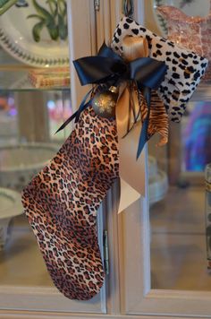 a leopard print bow hangs on the front door