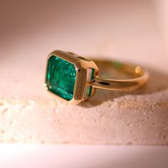 🖐Handmade item ✨Materials: Yellow gold, White gold, Rose gold, Platinum 💎Gemstone: Emerald 🤍Gem Color: Green 💍Band Color: Yellow gold 👑Style: Mid-century 🎨Can be personalized 🎁Gift wrapping available ● 𝐃𝐢𝐚𝐦𝐨𝐧𝐝 𝐃𝐞𝐭𝐚𝐢𝐥𝐬 → Shape: Asscher → Carat: approx 4.0 CT → Color: Green → Clarity: VS1 → Size: 11*9mm → Ring width: 2.5mm → Ring thickness: 2mm 𝗞𝗲𝘆 𝗙𝗲𝗮𝘁𝘂𝗿𝗲𝘀: Fiorese 14K Green Emerald Set Engagement Ring defines the balance of luxury and sophistication with its unique and elegant design. The center of this ring is a bright and magnificent green emerald, reflecting the vitality of nature and the novelty of spring. The selected emerald, with its dark green color, embodies the essence of the growth of all things and is paired with clear-cutting technology to ensur Luxury Yellow Gold Emerald Ring With Tension Setting, Chunky Emerald Ring, Luxury Gold Gemstones For Wedding, Yellow Gold Gemstone Ring Jewelry, Luxury Emerald Gemstones In Yellow Gold, Luxury Yellow Gold Emerald Gemstones, Luxury Yellow Gold Ring For May Birthstone, Classic Rose Gold Emerald Jewelry, Promise Emerald Birthstone Ring In Yellow Gold