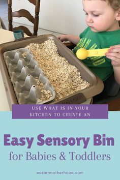 a young boy sitting at a table with an egg tray in front of him and the words easy sensory bin for babies and toddlers