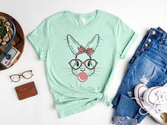 a women's t - shirt with an image of a bunny wearing glasses