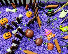 there are many halloween decorations on the purple rice