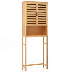 a tall wooden cabinet sitting on top of a white floor