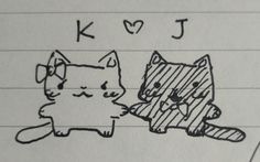 a drawing of two cats sitting next to each other on top of a piece of paper