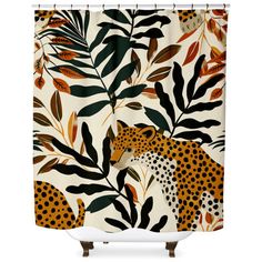 a shower curtain with leopards and leaves on it