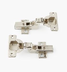 pair of stainless steel cabinet door latches on white background