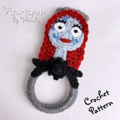 a crochet ring with a creepy face on it