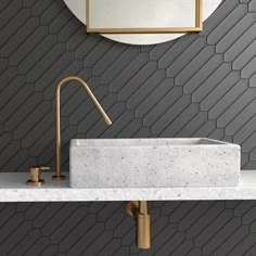 a white sink sitting under a mirror next to a faucet in a bathroom