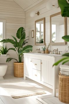 a bathroom with white walls and flooring has plants in baskets on the side of the bathtub