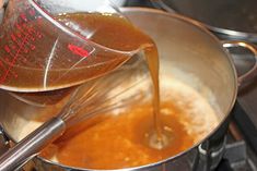 a pot filled with liquid being poured into it