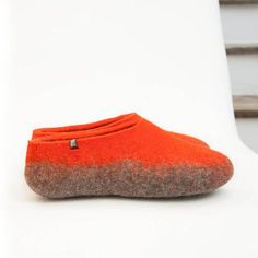 Felted wool slippers in orange and grey natural sheep wool. These womens wool clogs are slippers for all seasons. Wear them with or without socks, the wool will not irritate your skin. Our house slippers are made double thick at the area of the sole making them tough and hard wearing. Make a warm and unique gift for her, the favorite woman in your life!SIZESPLEASE INDICATE YOUR SIZE WITH YOUR ORDER. We make all sizes from women's EU 35 - UK 3 - US 5 up to  EU 42 - UK 9 - US 11. Do not order bigg Orange Slip-on Casual Slippers, Casual Orange Slip-on Slippers, Winter Indoor Felt Slippers, Wool Slippers With Leather Sole For Winter, Winter Wool Slippers With Rubber Sole, Winter Wool Slippers With Leather Sole, Winter Wool Slip-on Slippers, Wool Closed Toe Slippers For Winter, Cozy Wool Slip-on Slippers