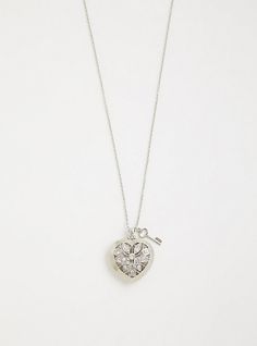 Shimmering rhinestones enliven a silver-tone heart pendant that glistens along your neckline. Lobster clasp. 31. 25” length with 3” extender. 2” pendant. Base metals. Imported. The best plus size women's rhinestone caged heart necklace necklaces in silver. Torrid is your destination for the freshest spring and summer styles. Glamorous Silver Necklace For Valentine's Day, Glamorous Silver Heart Jewelry, Silver Rhinestone Pendant Necklace For Valentine's Day, Silver Heart Pendant Rhinestone Necklace For Valentine's Day, Metal Heart Pendant Jewelry With Rhinestones, Silver Crystal Heart Pendant Necklace, Silver Heart-shaped Rhinestone Necklaces, Silver Heart-shaped Necklace With Rhinestones, Glamorous Heart-shaped Metal Jewelry