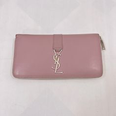 Brand: Yves Saint Laurent Color: Pink Material: Leather Inclusions: / Dimensions: W18.5cm X H10cm X D2.5cm Serial Number: Na Country Of Origin: Italy Condition: B - Good Condition. Accessory: Box, Paper And Bag, Introducing The Saint Laurent Wallet In A Beautiful Pink Color. This Wallet Is Crafted With High-Quality Leather, Known For Its Durability And Luxurious Feel. Condition: B (Good Condition But Signs Of Small Scratches And / Or Stains) Before Purchasing, Please Refer To The Images For The Exact Condition Of The Item. All Sales Are Final. No Return Accepted. Thank You! Saint Laurent Wallet, Yves Saint Laurent Bags, Box Paper, The Saint, Long Wallet, Pink Leather, High Quality Leather, Pink Color, Yves Saint Laurent