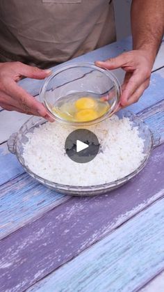 a man is making rice with eggs in a bowl