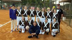 the softball team is posing for a group photo