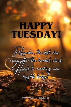 a coffee cup sitting on top of a wooden table with the words happy tuesday written in black