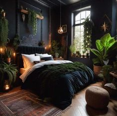 a bedroom with black walls and plants on the bed