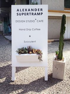 there is a sign that says, design studio cafe and drip coffee succulent