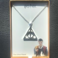 a harry potter necklace in a box