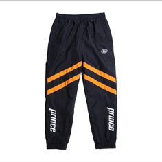 Prince Vs Tito's Black Baseline Windbreaker Pants Size Large Black/Orange Complete Your Prince Vs Tito's Track Suit With A Pair Of Prince Vs Tito's Black Baseline Windbreaker Pants. Made For Breezy Days When You Want To Add Some Swish To Your Swagger. Sporting This Signature Set Is About As "Tito's Official" As You Can Get. They Feature Bright Orange Stripes With The Prince Logo In Hd Gel Print On The Legs, And A White Embroidered Tito's Pot Still Emblem On The Left Hip With A True Fit. Bin_185 Prince Logo, Windbreaker Pants, Pink Joggers, Pot Still, Fitted Joggers, Mens Fashion Streetwear, Track Suit, Grey Joggers, Mens Joggers