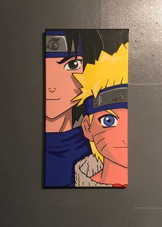 two anime characters are depicted on a piece of paper that is hanging on the wall