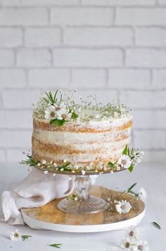 a cake with flowers and two birds on top