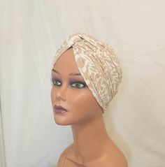 Handmade vintage style pretied front twist turban. This turban is a simple yet stylish cap made out of a soft feel jersey fabric.  This is perfect to be worn with hair up or down, indoors or outdoors, social and religious gatherings.  It's made in two layers therefore can provide warmth for your head and ears in cold weather while still remaining stylish.  This can serve as a gift to a loved one, wife, mum, sister, daughter or friend. It's a go to cap for women passing through illness, chemo, al Summer Wrap Turban, Beach Turban With Knotted Detail, Adjustable Knotted Turban, Elegant One Size Turban For Beach, Elegant One Size Beach Turban, Elegant One-size Beach Turban, Elegant Adjustable Beanie Turban, Elegant White Summer Turban, Adjustable Cream Headwrap