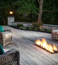 a fire pit sitting on top of a wooden deck