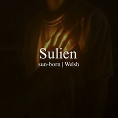 the words sullien are lit up in front of a man's face