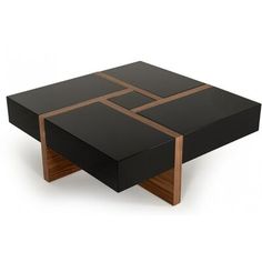 a black coffee table with wooden accents on it's sides and two brown squares on the top