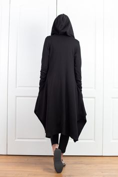 "Wool Cape, Knit Cardigan, Cloak with Hood This asymmetrical and modern cloak with hood has two side pockets, super comfy hood and thumb holes for a fabulous look. The model in the picture is 168cm. ⅼ 5.6 ft. tall and is wearing size S / color: black 🌟 INFO: * Worldwide EXPRESS shipping - please provide a phone number for shipping documents * US Sizing XS to 4XL - body size chart available below * We offer customization to Personal Measurements & Larger Sizes 5XL, 6XL, 7XL .... 🌟 MATERIAL Cloak With Hood, Shipping Documents, Cardigan Knitted, Wool Top, Wool Cape, Jacket Vest, Knitted Top, Kimono Cardigan, Thumb Holes