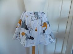 a dress made to look like a skirt with animals on it