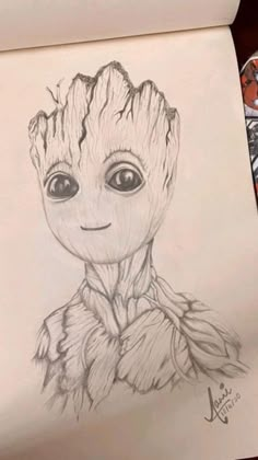 a drawing of baby groote from the avengers movie is being drawn on paper