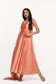 A bright peach attire, features dupion dress with embroidered net jacket. The look is highlighted with tassel details, and matching dupatta . . . . . . . . . . . . . . . . . #punjabiwear #diyaonline #ootd #diyaskin #ootn #happy #style #fashion #lehenga #lehengacholi #happy #diwali #indianwear #fashion #shopping #shopnow #love #style Fashion Lehenga, Net Jacket, Happy Diwali, Lehenga Choli