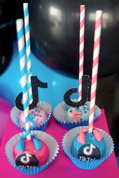 three birthday cupcakes with candles in the shape of numbers one to ten on them