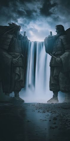 two statues standing in front of a waterfall