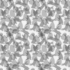 a gray and white pattern with rabbits on it