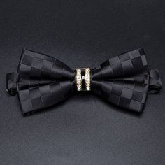 Look your best with this classic Luxury Bowtie. Steeped in timeless style, it will instantly elevate any outfit. Crafted from the highest quality fabric, this bow tie is designed for comfort, durability and style. SPECIFICATIONS Size: One SizeSIZE: 12*6CMMaterial: Polyester Classic Adjustable Bow For Business, Adjustable Classic Bow For Business, Classic Bow With Butterfly Knot, Elegant Fitted Bow As Gift, Elegant Fitted Bow For Gift, Dapper Tie With Butterfly Knot For Black Tie Events, Standard Tie With Butterfly Knot For Black Tie Events, Elegant Black Bow For Business, Classic Black Tie Bow Tie