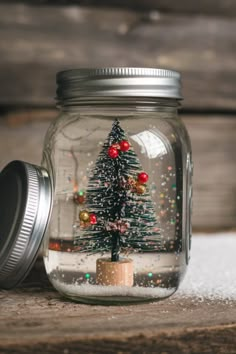 Easy Snow Globe Craft: Perfect for Holiday Gifts & Decor Homemade Christmas Snow Globes, Christmas Craft Snow Globe, Mini Snow Globes Diy, Home Made Snow Globes, Diy Snowglobe Ornament, How To Make A Snow Globe, Snowglobe Ideas, Snowglobe Diy