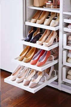 the shoe rack is filled with many pairs of shoes