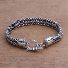 Men's Silver Bracelet Sterling 925 Handmade - Balinese Centipede | NOVICA Spiritual Sterling Silver Braided Bracelet, Handmade Round Sterling Silver Braided Bracelet, Handmade Silver Braided Sterling Silver Bracelet, Traditional Silver Braided Bracelet With Jubilee Style, Silver Braided Bangle Bracelet With Sterling Silver Clasp, Silver Spiral Bohemian Bracelets, Silver Braided Bracelet With Sterling Silver Clasp, Silver Sterling Braided Bracelets, Handmade Sterling Silver Braided Bohemian Bracelets